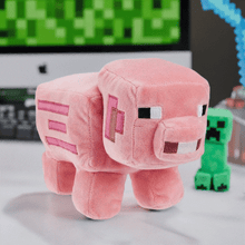Load image into Gallery viewer, Minecraft 8" Pig Plush with pixelated detailing on a desk setup.