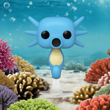 Load image into Gallery viewer, Horsea Pokemon POP! Vinyl Figure displayed underwater among colorful corals.