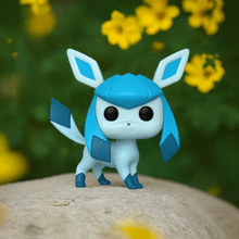 Load image into Gallery viewer, Glaceon Pokemon POP! Vinyl figure with icy blue design on a natural background.
