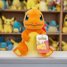 Load image into Gallery viewer, Pokemon 8 Inch Plush - Charmander Sitting on display shelf surrounded by plush toys.