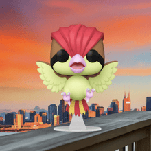 Load image into Gallery viewer, Pidgeotto Pokemon POP! Vinyl Figure on display with stylized design and vibrant colors, set against a cityscape backdrop.