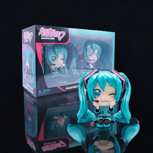 Load image into Gallery viewer, Hatsune Miku Collectible Twin Figure Pack showcasing two expressive figures with vibrant colors and intricate details.