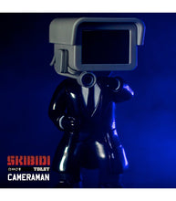 Load image into Gallery viewer, Skibidi Toilet Mystery Figure Series 1 - Cameraman collectible toy in dramatic lighting.