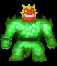 Load image into Gallery viewer, Goo Jit Zu Glow Shifters Ultraglow Blazagon action figure glowing in the dark.