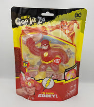 Load image into Gallery viewer, Heroes of Goo Jit Zu The Flash toy in packaging, featuring stretchy, gooey superhero action figure suitable for ages 4+.
