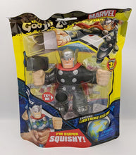 Load image into Gallery viewer, Heroes of Goo Jit Zu Thor toy in packaging, stretchy superhero with lightning filling.