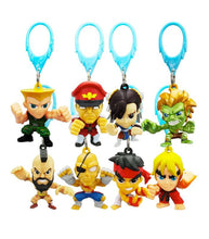 Load image into Gallery viewer, Street Fighter Mystery Hangers featuring collectible characters like Ken, Sagat, and Ryu used as keychains.