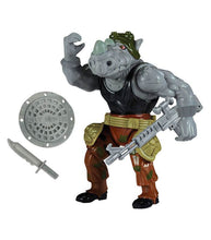 Load image into Gallery viewer, Teenage Mutant Ninja Turtles Classic Rocksteady action figure with accessories and multiple articulation points.