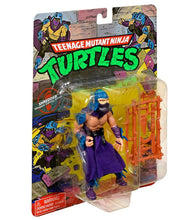 Load image into Gallery viewer, Teenage Mutant Ninja Turtles Classic Shredder action figure from 1988 with weapons and articulated joints in original packaging.