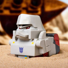 Load image into Gallery viewer, TUBBZ Transformers Megatron Collectible Duck in desert setting, featuring signature black and red colors, face mask, and fusion cannon.