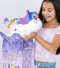 Load image into Gallery viewer, Young girl holding Aphmau MeeMeows Mystery 11" Plush from Celestial Collection, Rainbow Cat version.
