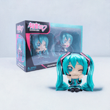 Load image into Gallery viewer, Hatsune Miku Collectible Twin Figure Pack showcasing two figures with signature twin-tail design, in front of a themed box.
