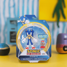 Load image into Gallery viewer, Hedgehog Sonic figure with collectible ring container in packaging.
