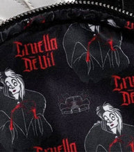 Load image into Gallery viewer, Loungefly Disney Villains Cruella De Vil mini backpack with polka dots and Cruella's smirk design.
