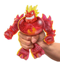 Load image into Gallery viewer, Heroes of Goo Jit Zu Goo Shifters Blazagon toy being squeezed in hand, showcasing color-changing and stretchable features.
