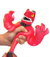 Load image into Gallery viewer, Goo Jit Zu Dino X-Ray Fossil Faceoff Thrash squeezing action figure.
