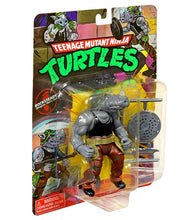 Load image into Gallery viewer, Teenage Mutant Ninja Turtles Classic Rocksteady action figure in packaging with weapons.

