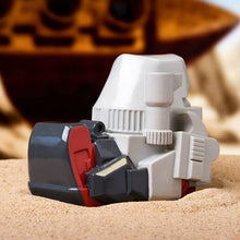 Load image into Gallery viewer, TUBBZ Transformers Megatron Collectible Duck on sandy surface with detailed black and red design, fusion cannon visible.
