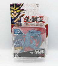 Load image into Gallery viewer, Blue Eyes White Dragon Yu-Gi-Oh! battle figure with exclusive card in packaging.
